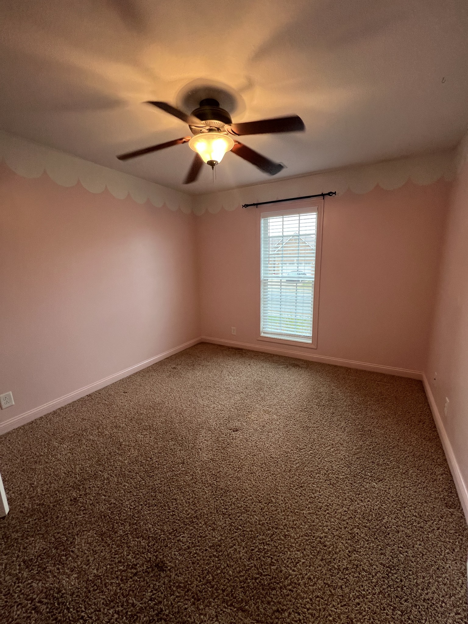 1745 Apache Way Clarksville, TN 37042 - Photo 13 of 28 an empty room with a window and a fan