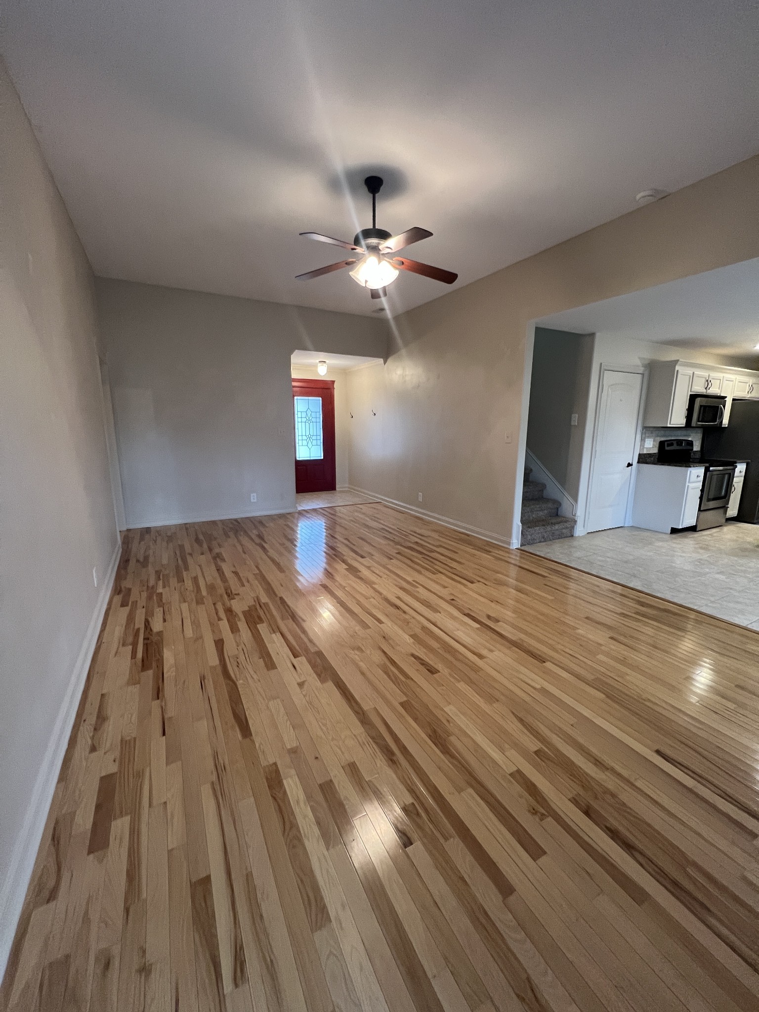 1745 Apache Way Clarksville, TN 37042 - Photo 4 of 28 wooden floor in an empty room with a window