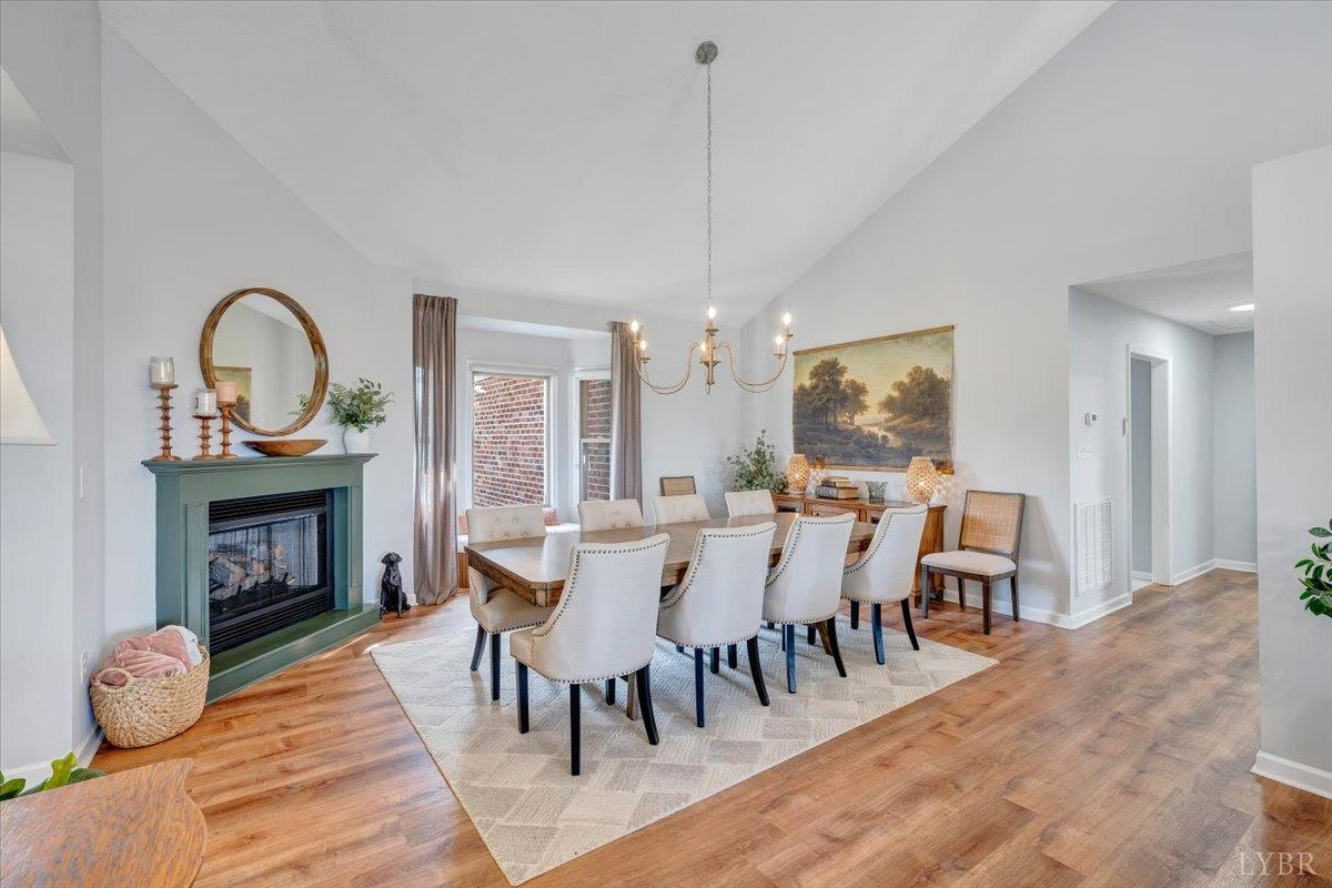 5129 Wheatland Road Bedford, VA 24523 - Photo 11 of 51 a view of a dining room with furniture window and wooden floor