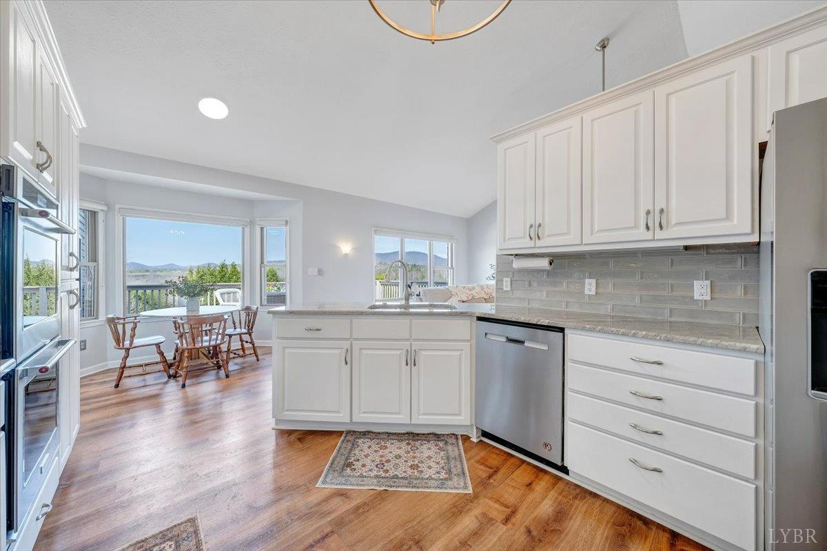 5129 Wheatland Road Bedford, VA 24523 - Photo 19 of 51 a kitchen with sink and cabinets