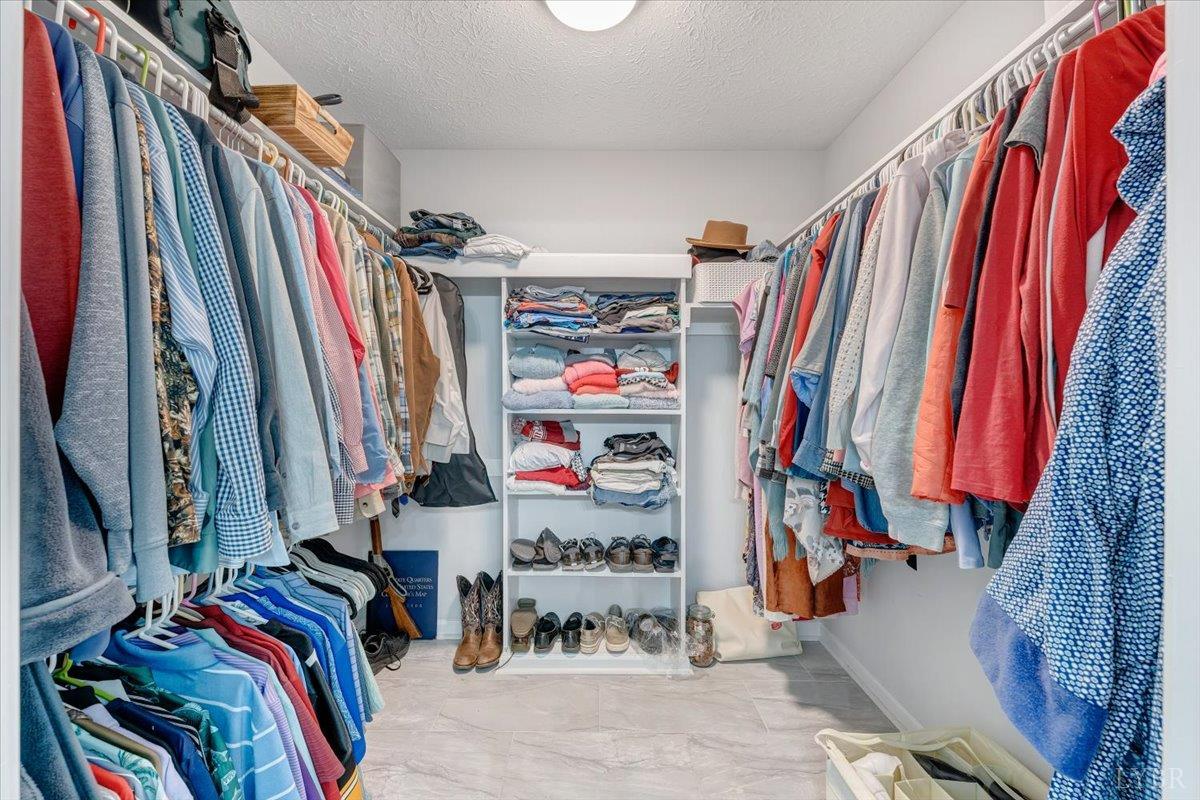 5129 Wheatland Road Bedford, VA 24523 - Photo 28 of 51 a view of walk in closet with clothes