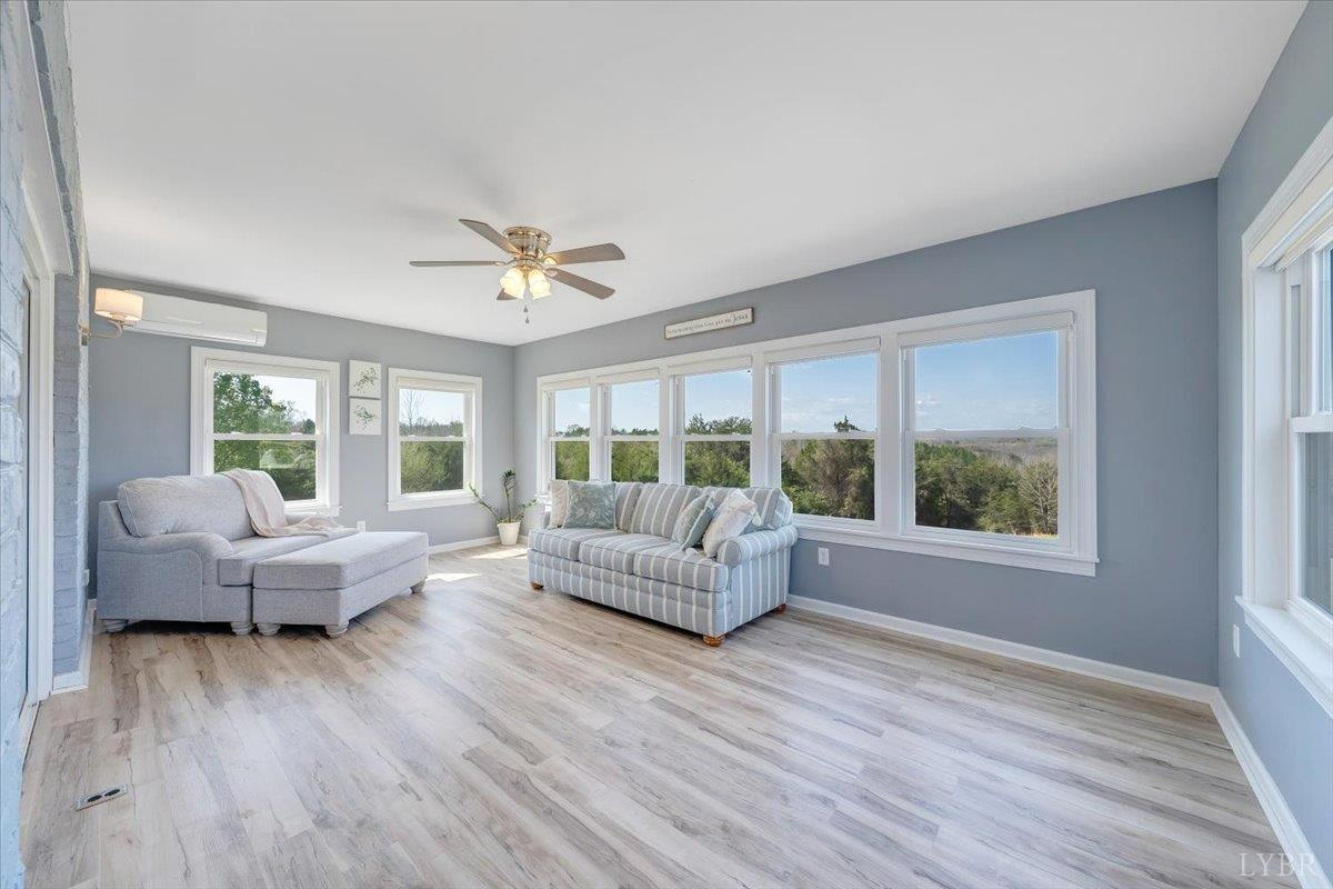 5129 Wheatland Road Bedford, VA 24523 - Photo 29 of 51 a living room with furniture and a large window