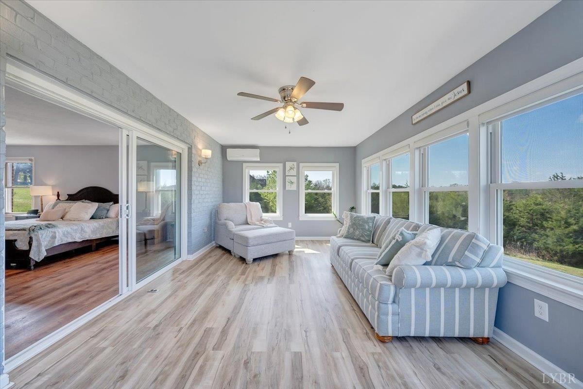 5129 Wheatland Road Bedford, VA 24523 - Photo 30 of 51 a living room with furniture and a large window
