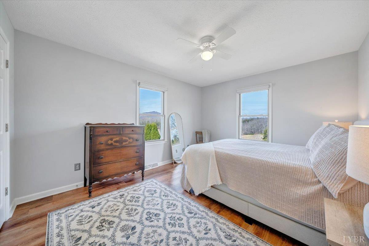 5129 Wheatland Road Bedford, VA 24523 - Photo 32 of 51 a bedroom with a bed and a dresser