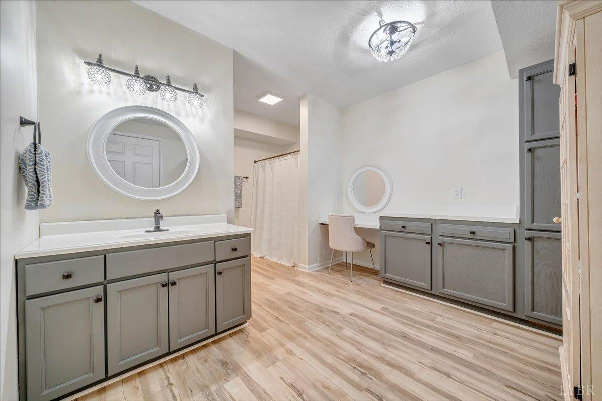 5129 Wheatland Road Bedford, VA 24523 - Photo 44 of 51 a bathroom with a sink a mirror and a shower