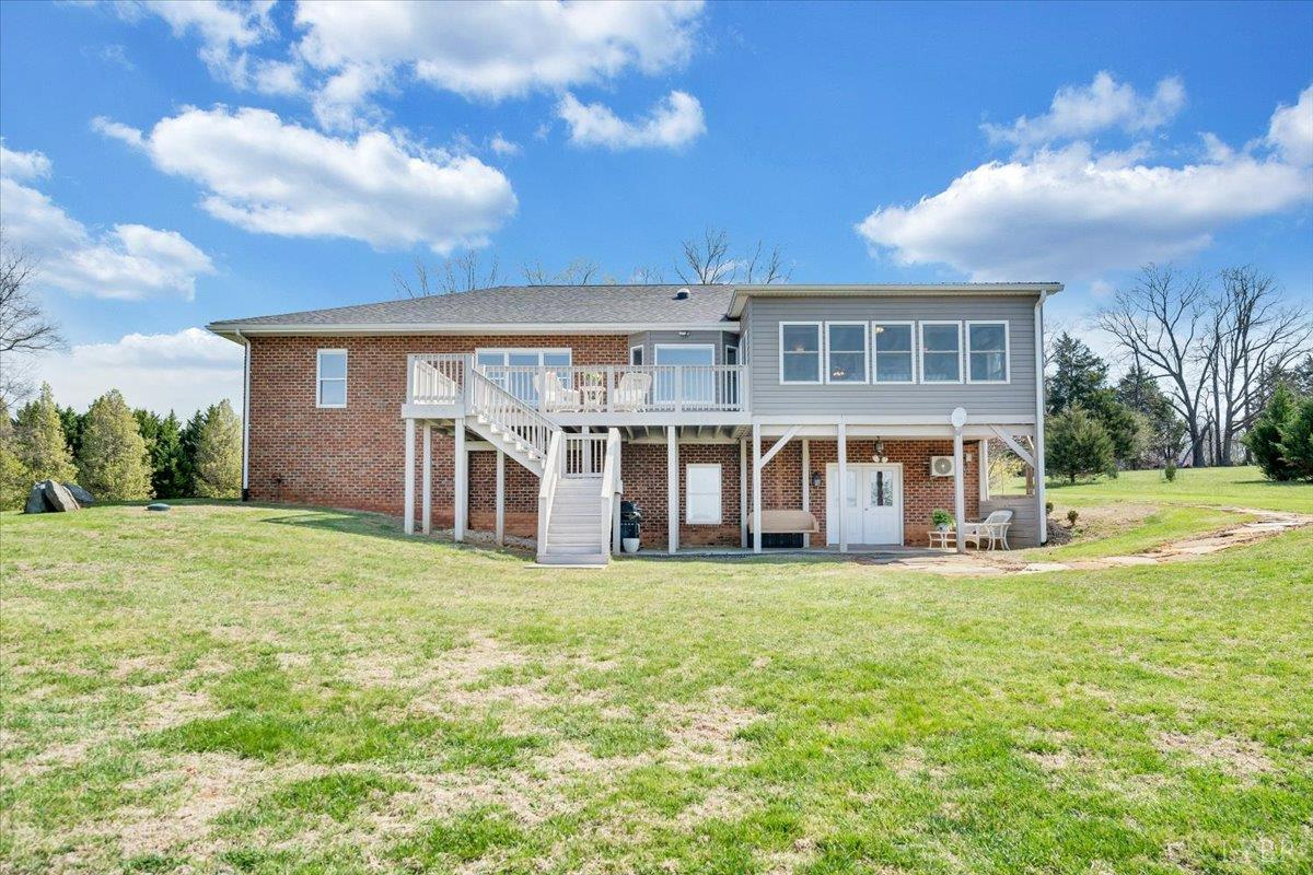 5129 Wheatland Road Bedford, VA 24523 - Photo 49 of 51 a big house with a big yard and large trees