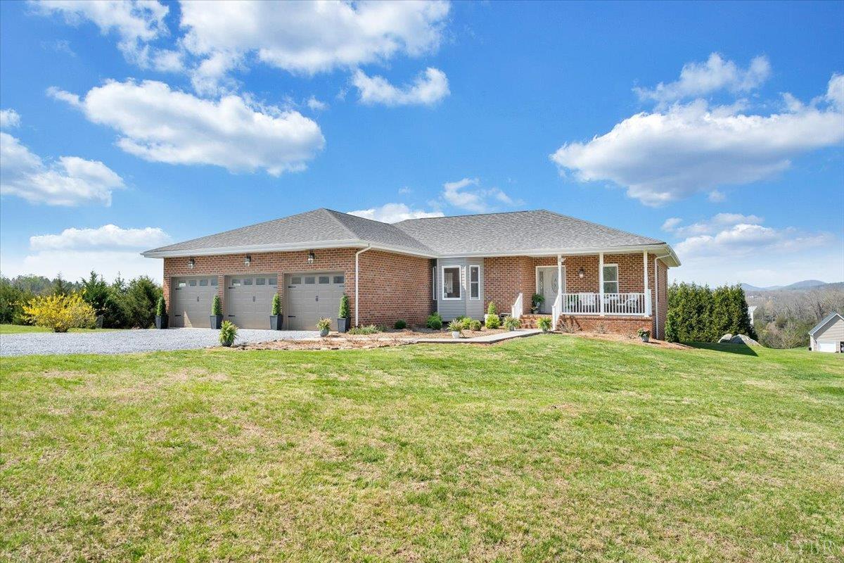 5129 Wheatland Road Bedford, VA 24523 - Photo 5 of 51 a front view of a house with a garden
