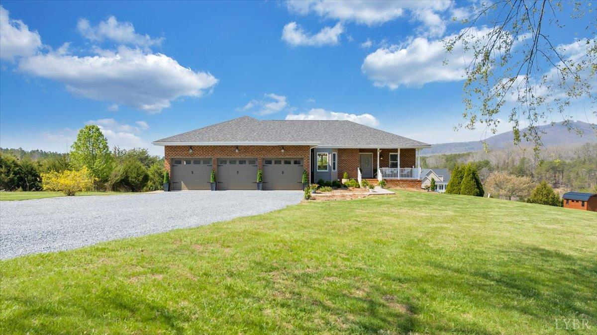 5129 Wheatland Road Bedford, VA 24523 - Photo 6 of 51 a front view of a house with yard and green space