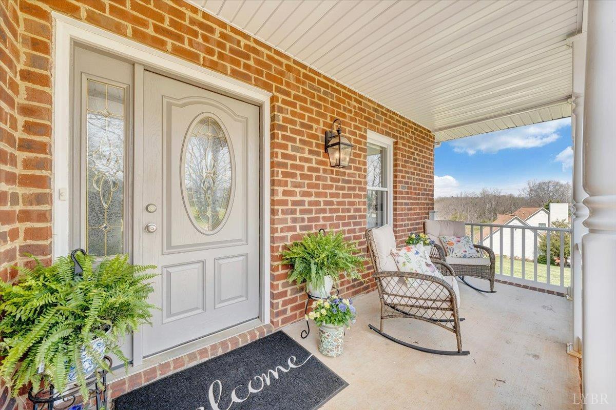 5129 Wheatland Road Bedford, VA 24523 - Photo 9 of 51 a balcony with furniture and potted plants