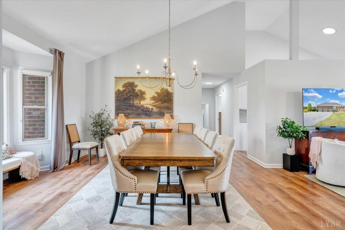 5129 Wheatland Road Bedford, VA 24523 - Photo 10 of 51 a dining room with furniture and wooden floor
