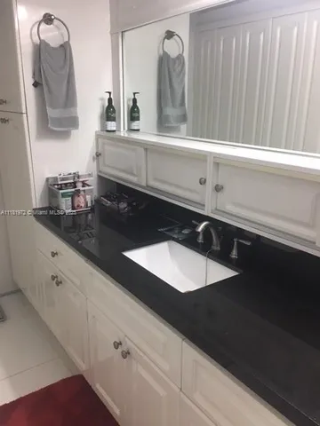 a close view of sink and mirror
