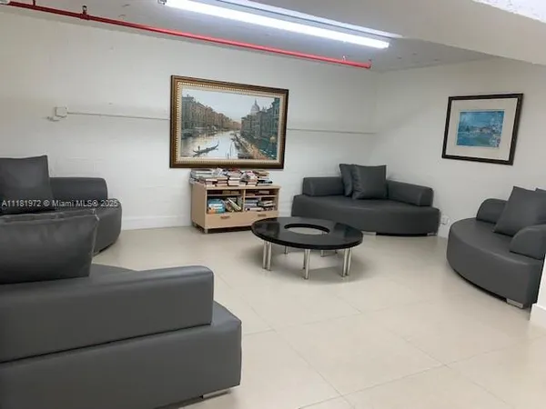 a room with furniture and a rug