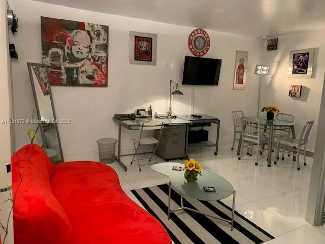 a room with furniture and wooden floor