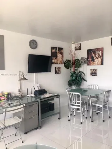 a kitchen with stainless steel appliances kitchen island granite countertop a sink and cabinets
