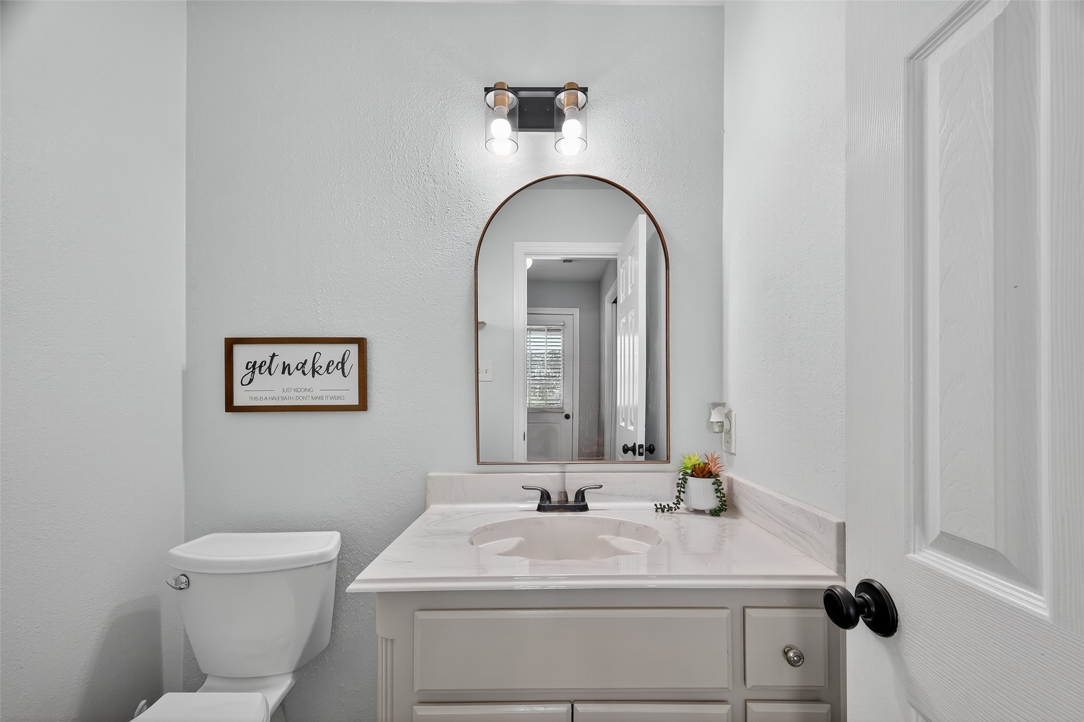1030 Ginger Street Santa Fe, TX 77517 - Photo 17 of 50 a bathroom with a sink and a mirror