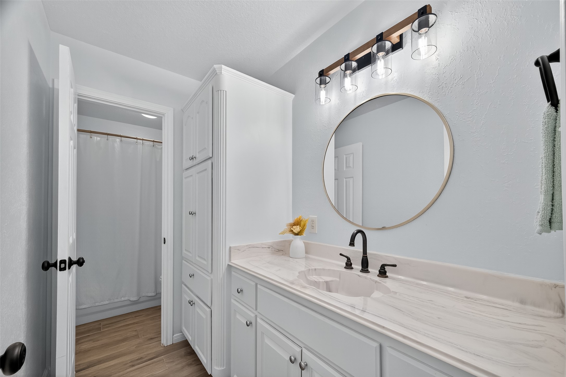 1030 Ginger Street Santa Fe, TX 77517 - Photo 22 of 50 a bathroom with a sink and a mirror