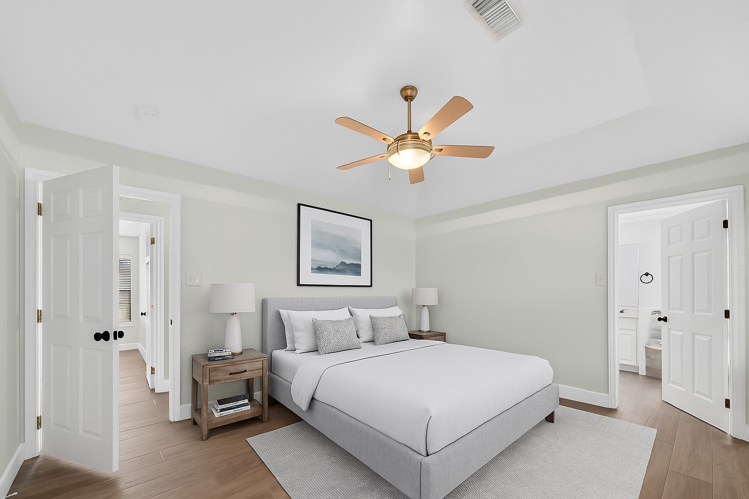 1030 Ginger Street Santa Fe, TX 77517 - Photo 25 of 50 a bedroom with a large bed and a chandelier