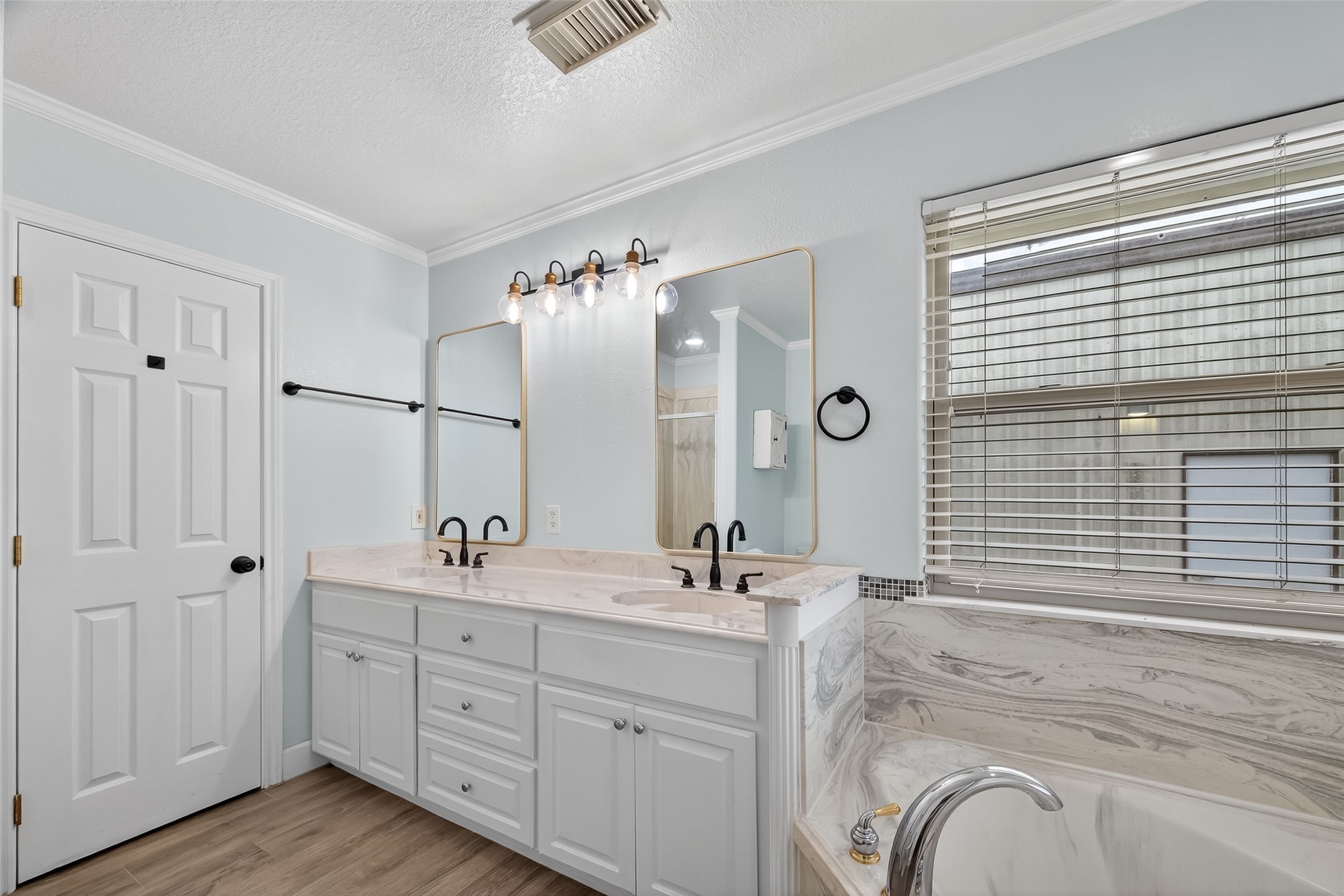 1030 Ginger Street Santa Fe, TX 77517 - Photo 26 of 50 a spacious bathroom with a double vanity sink a mirror and a shower