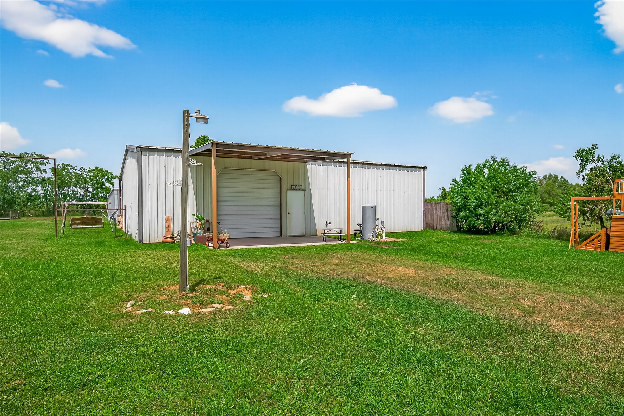 1030 Ginger Street Santa Fe, TX 77517 - Photo 33 of 50 a front view of house with garden and patio