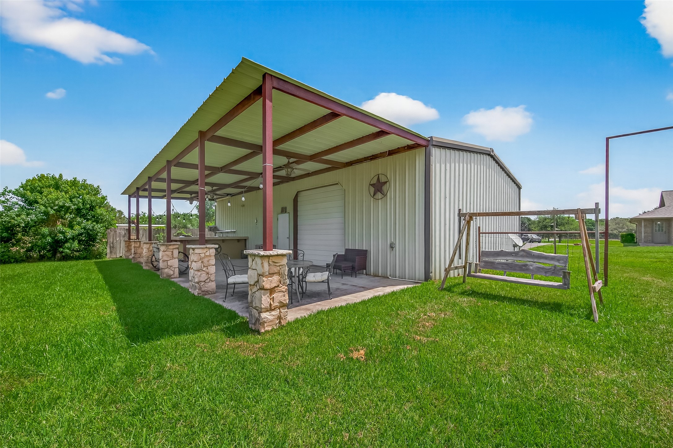 1030 Ginger Street Santa Fe, TX 77517 - Photo 38 of 50 a view of a chair and table in backyard of the house