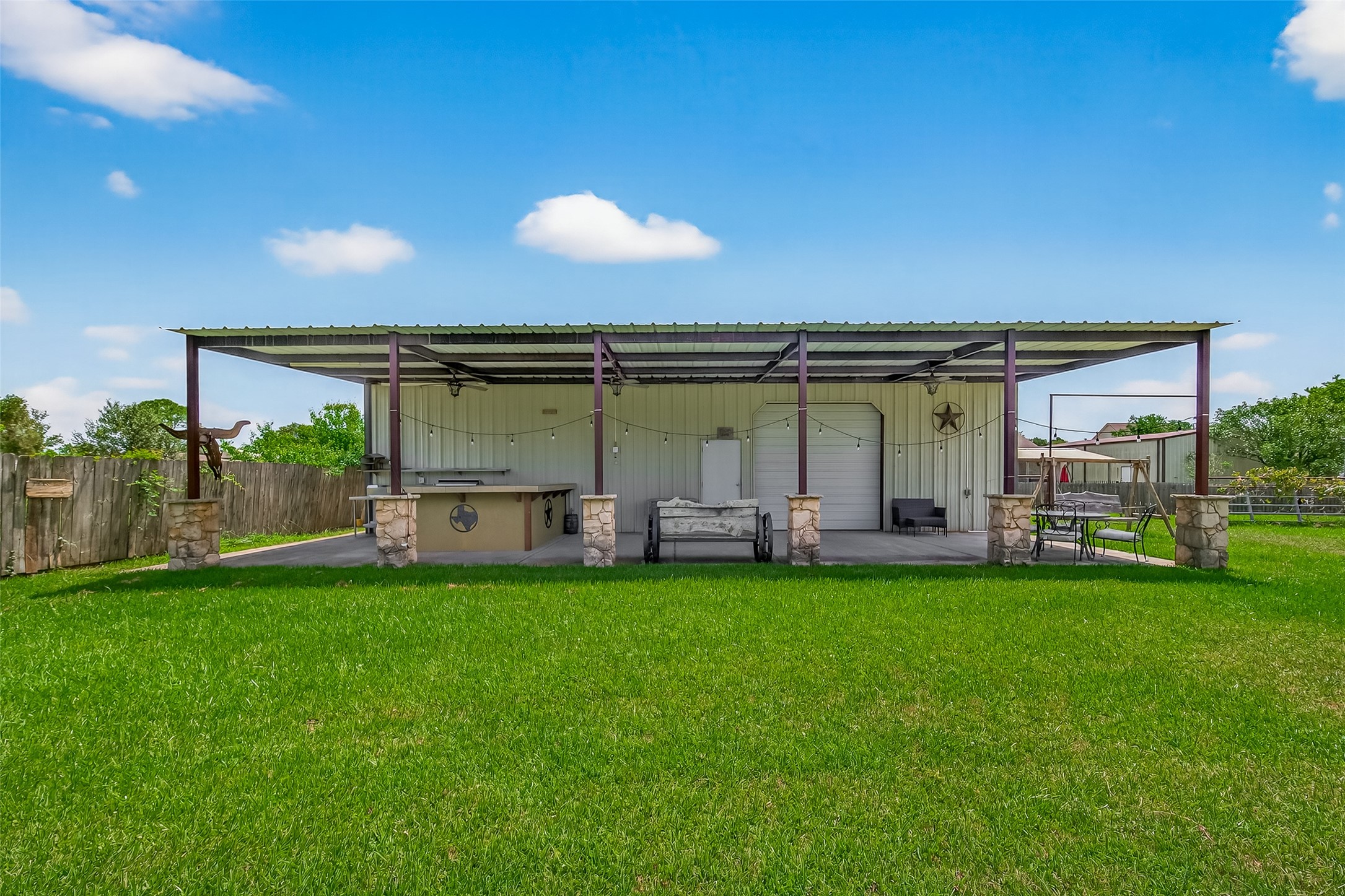1030 Ginger Street Santa Fe, TX 77517 - Photo 39 of 50 a view of a house with a backyard porch and sitting area