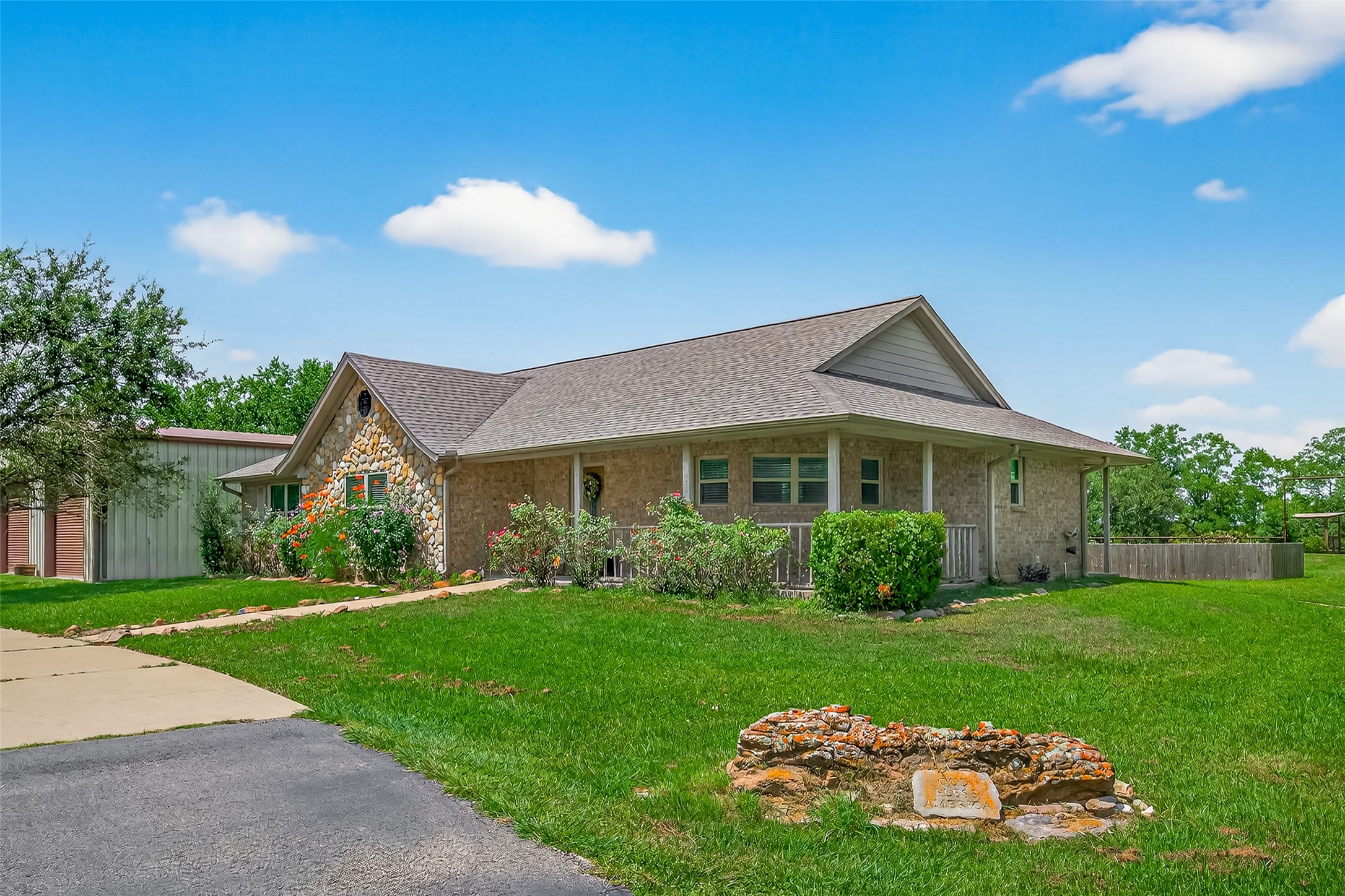 1030 Ginger Street Santa Fe, TX 77517 - Photo 4 of 50 a front view of a house with a yard and garage