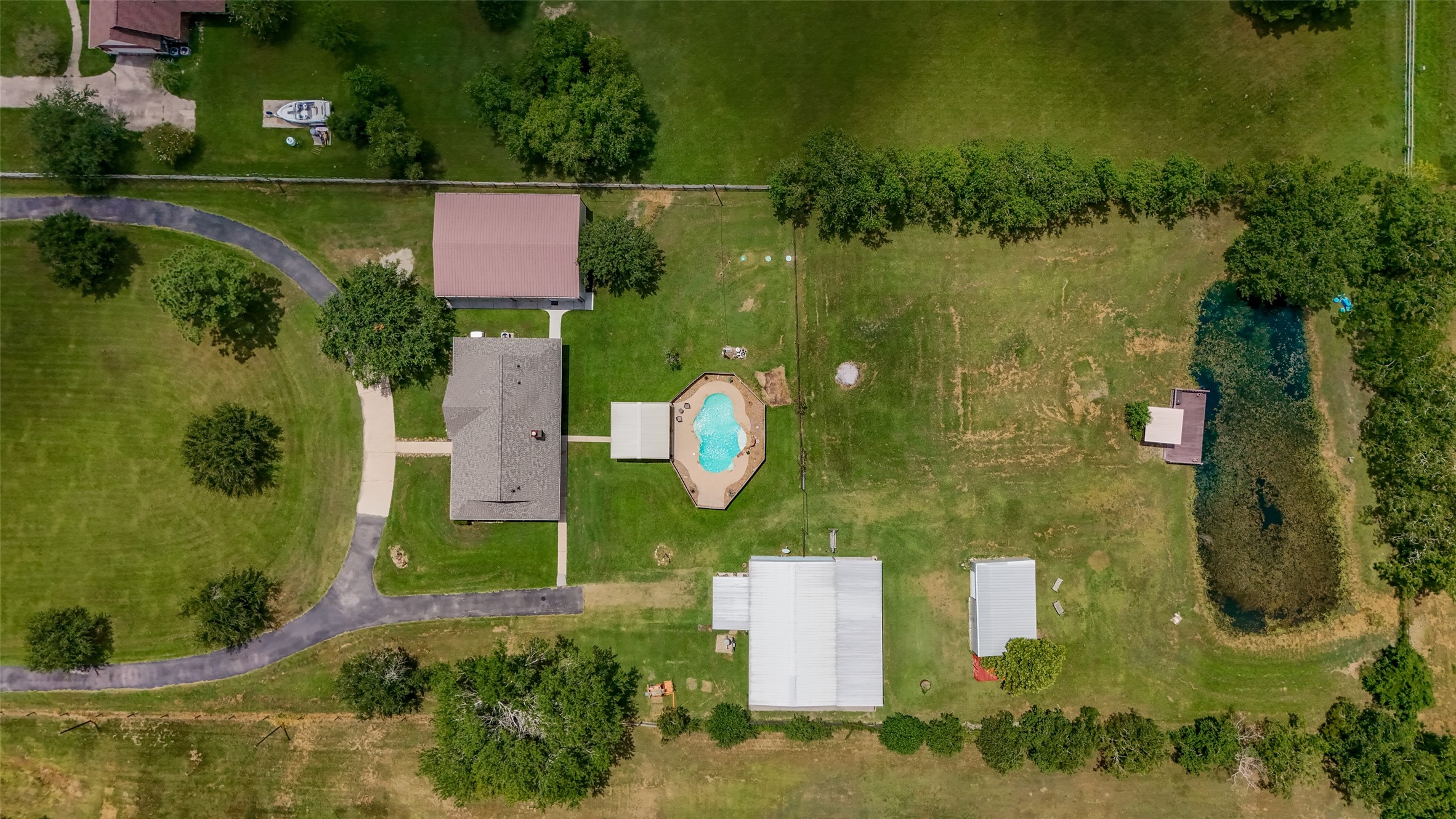 1030 Ginger Street Santa Fe, TX 77517 - Photo 47 of 50 an aerial view of residential house with outdoor space and swimming pool