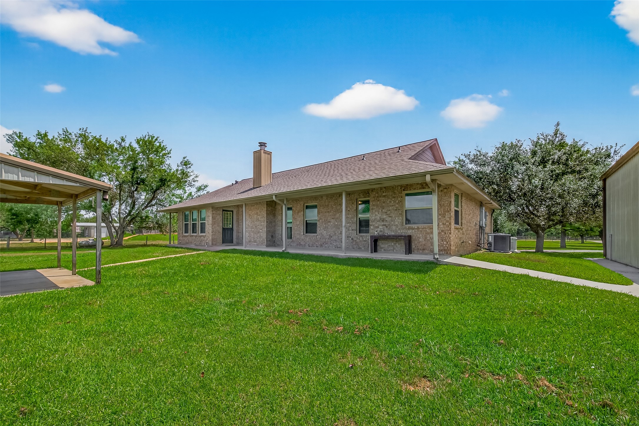 1030 Ginger Street Santa Fe, TX 77517 - Photo 5 of 50 a view of a house with a backyard and a patio