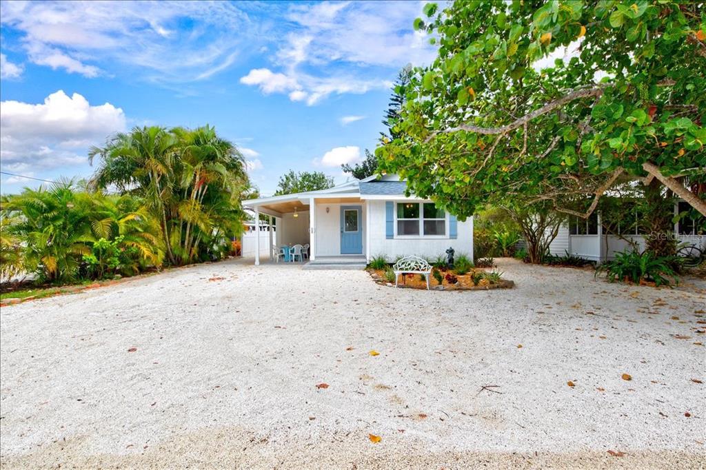 651 Linley Street Longboat Key, FL 34228 - Photo 1 of 1 a view of a house with backyard and sitting area