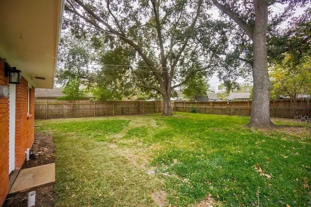 a view of outdoor space with deck and trees
