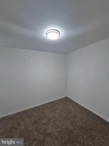 an empty room with a empty space and window