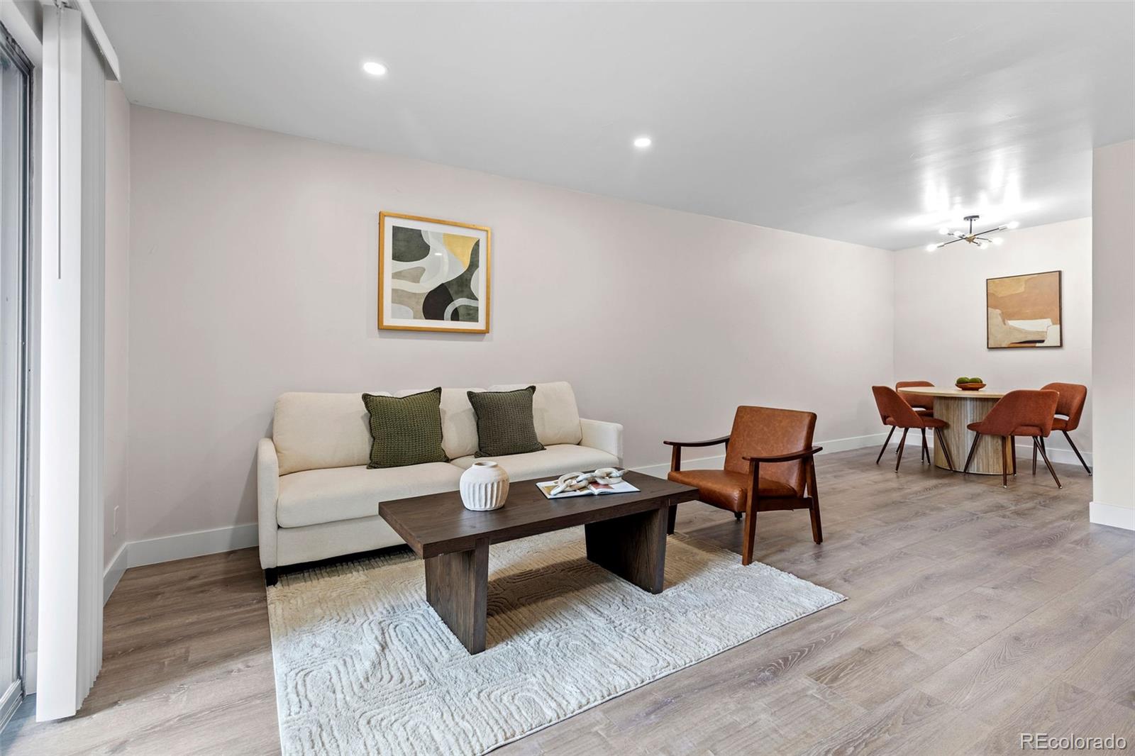 7495 East Quincy Avenue, Unit 202 Denver, CO 80237 - Photo 13 of 28 a living room with furniture and wooden floor