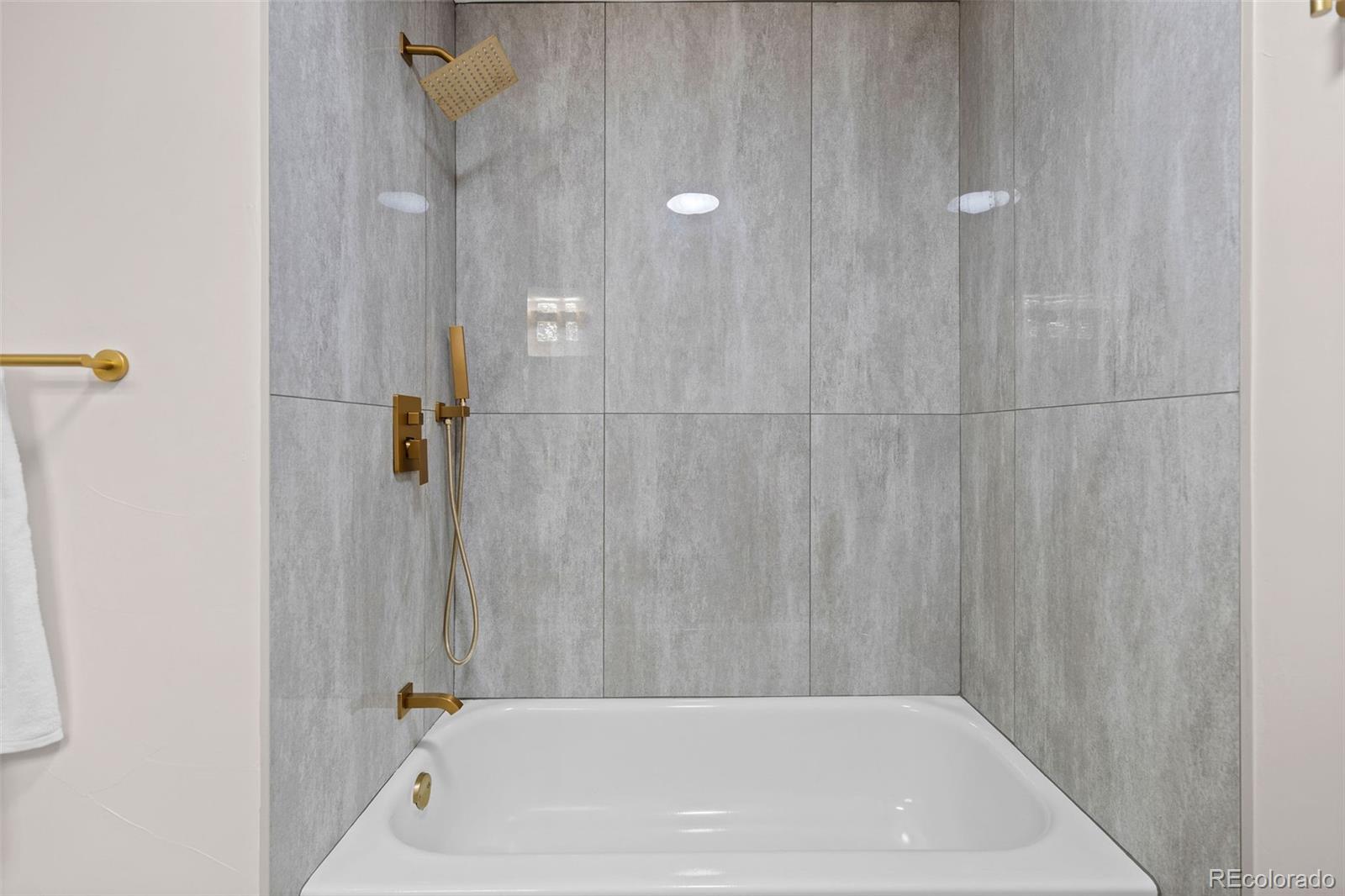 7495 East Quincy Avenue, Unit 202 Denver, CO 80237 - Photo 19 of 28 a bathroom with a bathtub