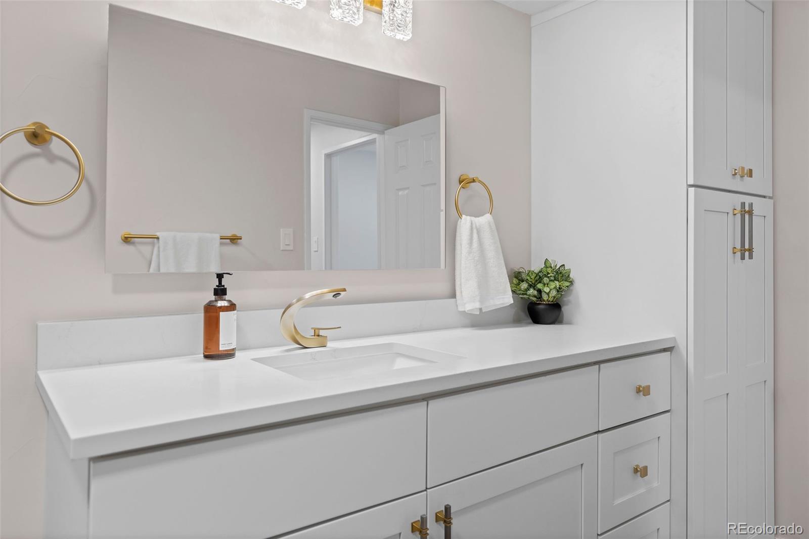 7495 East Quincy Avenue, Unit 202 Denver, CO 80237 - Photo 20 of 28 a bathroom with a sink and a mirror