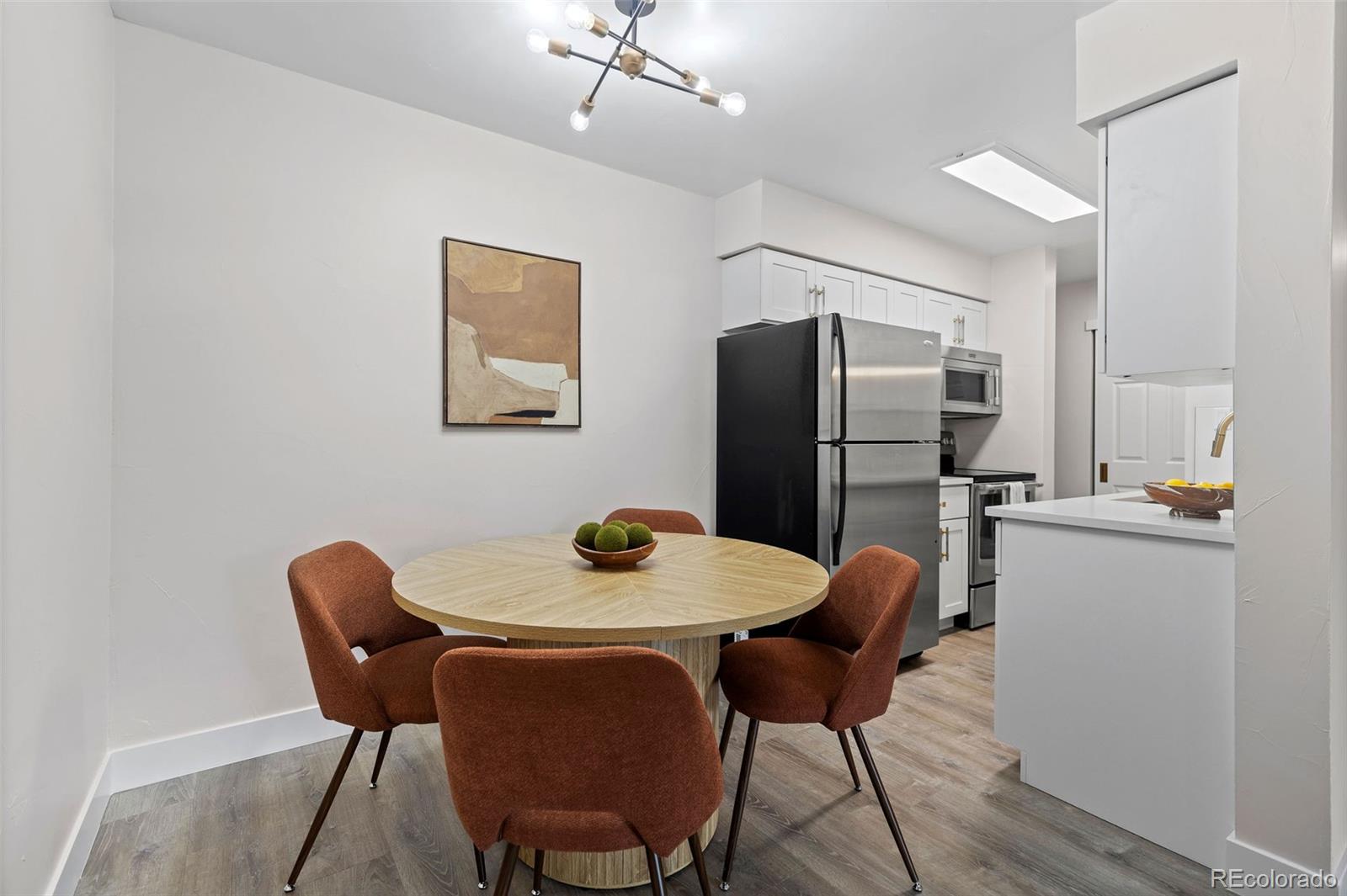 7495 East Quincy Avenue, Unit 202 Denver, CO 80237 - Photo 7 of 28 a dining room with furniture and window