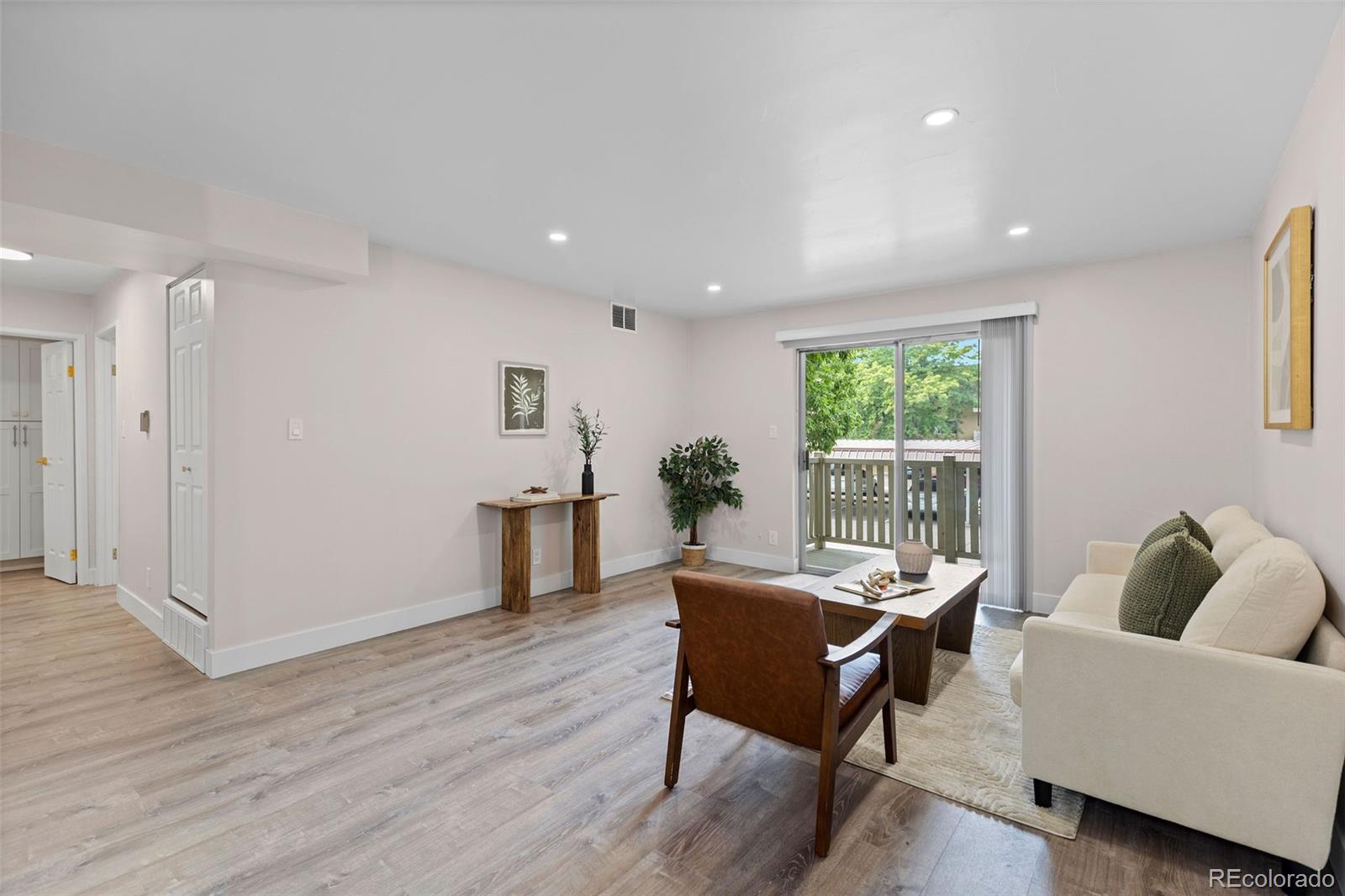 7495 East Quincy Avenue, Unit 202 Denver, CO 80237 - Photo 8 of 28 a living room with furniture and a window