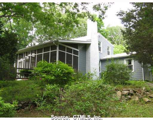 1889 Little Meadow Road Guilford, CT 06437 - Photo 1 of 1 a view of house with tall trees