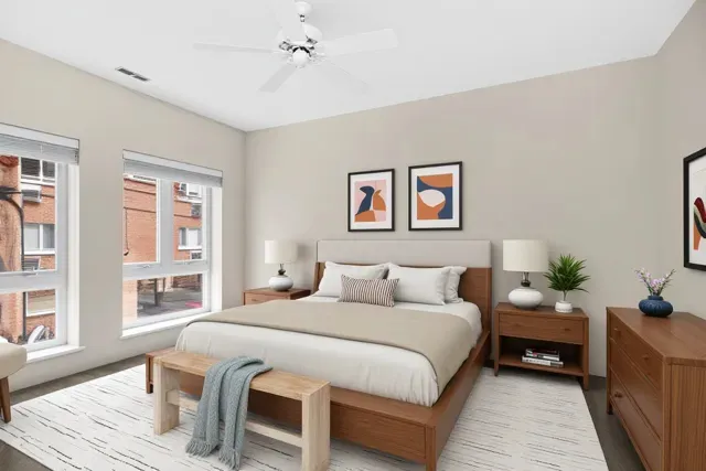 a bedroom with a large bed and a couch