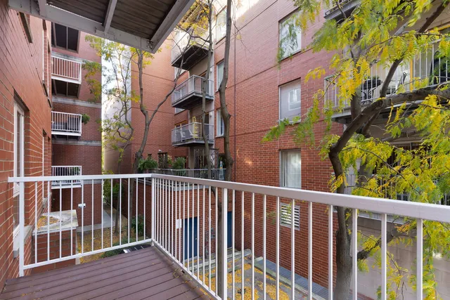 a view of a brick building from a balcony