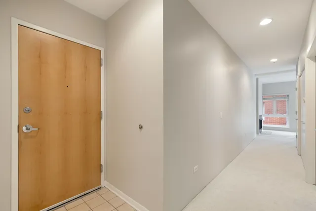 a view of a hallway with closet area