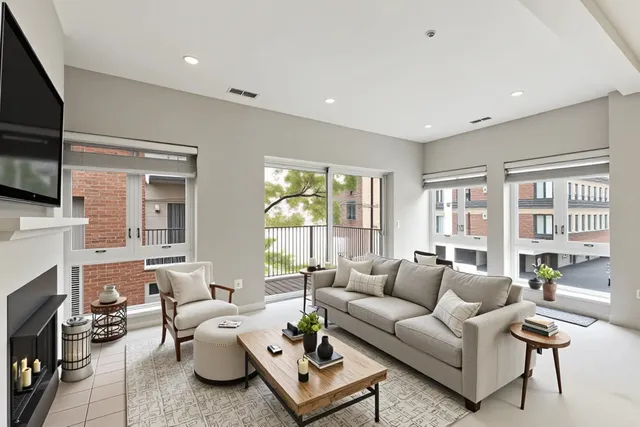 a living room with furniture fireplace and a flat screen tv