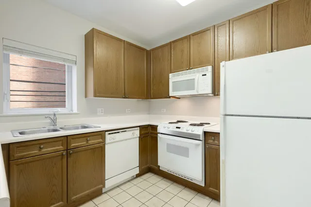 a kitchen with a sink a stove and refrigerator