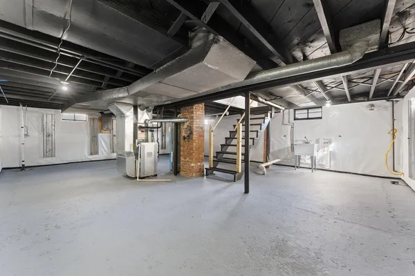 a view of empty room with wooden ceiling