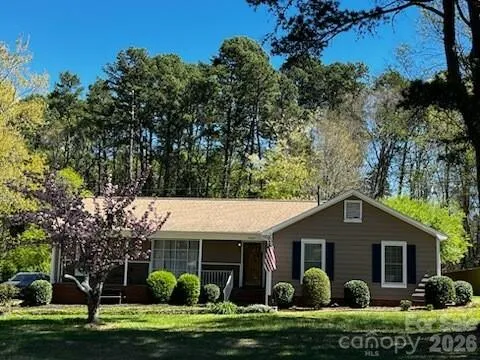 a view of a house with a yard and plants