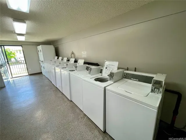 a view of storage and utility room with washer and dryer
