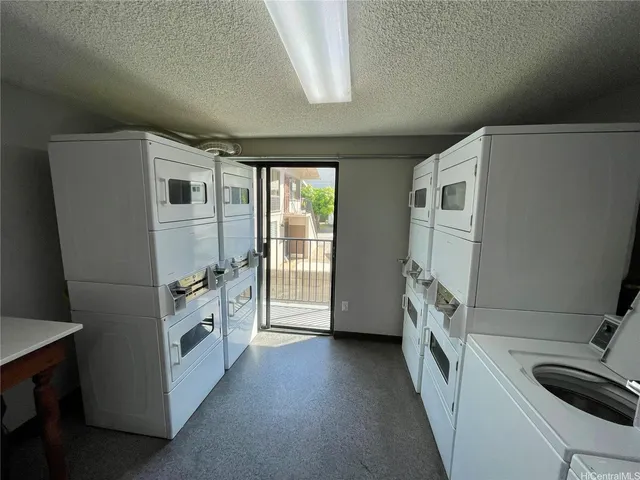 a view of a storage and utility room with washer and dryer