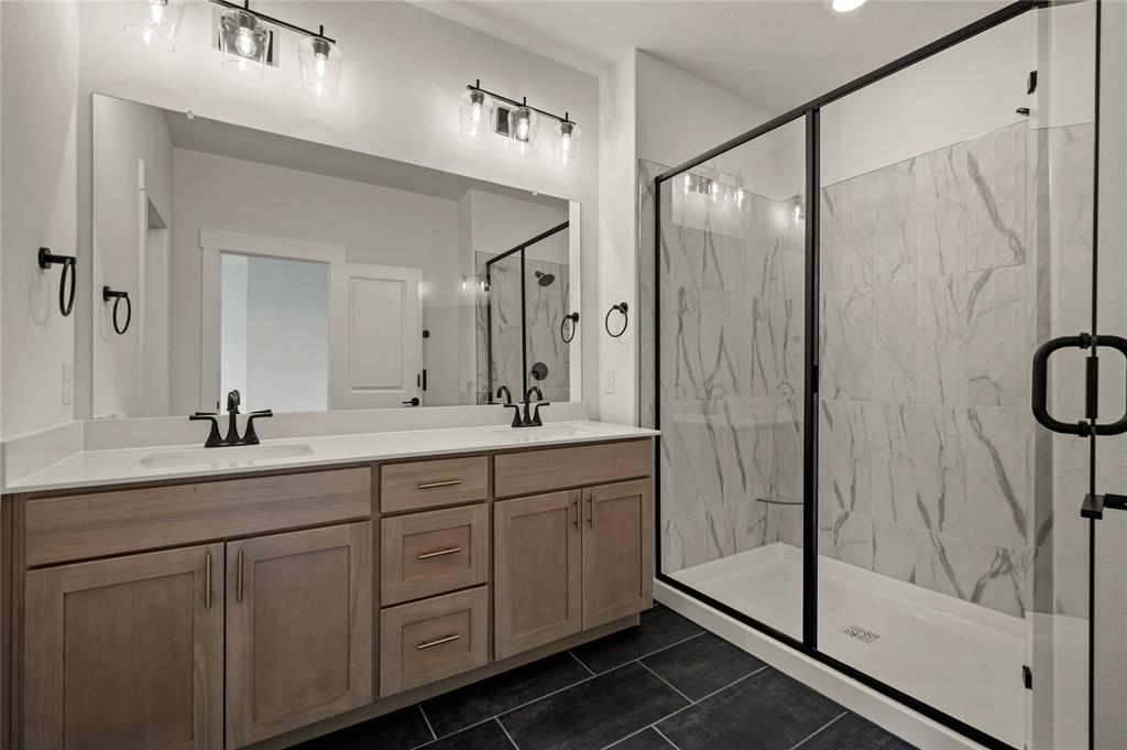 2550 Brunswick Way Allen, TX 75013 - Photo 16 of 24 a bathroom with a double vanity sink mirror and shower