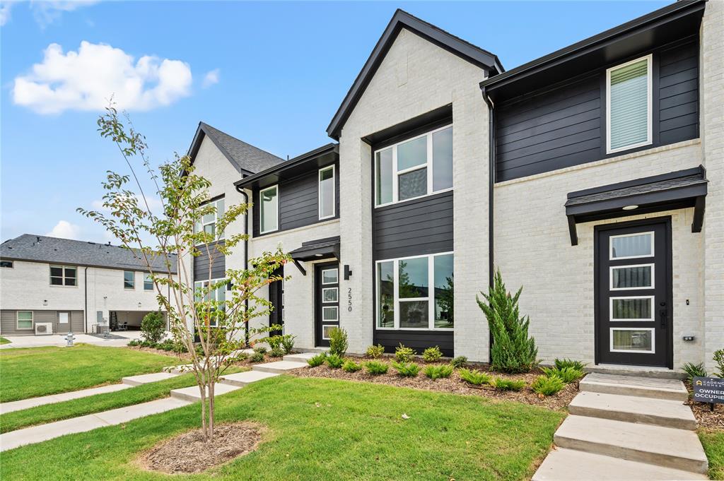 2550 Brunswick Way Allen, TX 75013 - Photo 3 of 24 a front view of a house with a yard