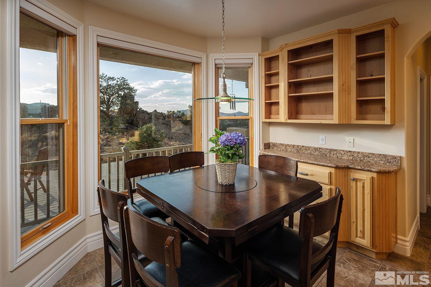 4530 Lousetown Road Reno, NV 89521 - Photo 11 of 39 a view of a dining room with furniture window and wooden floor