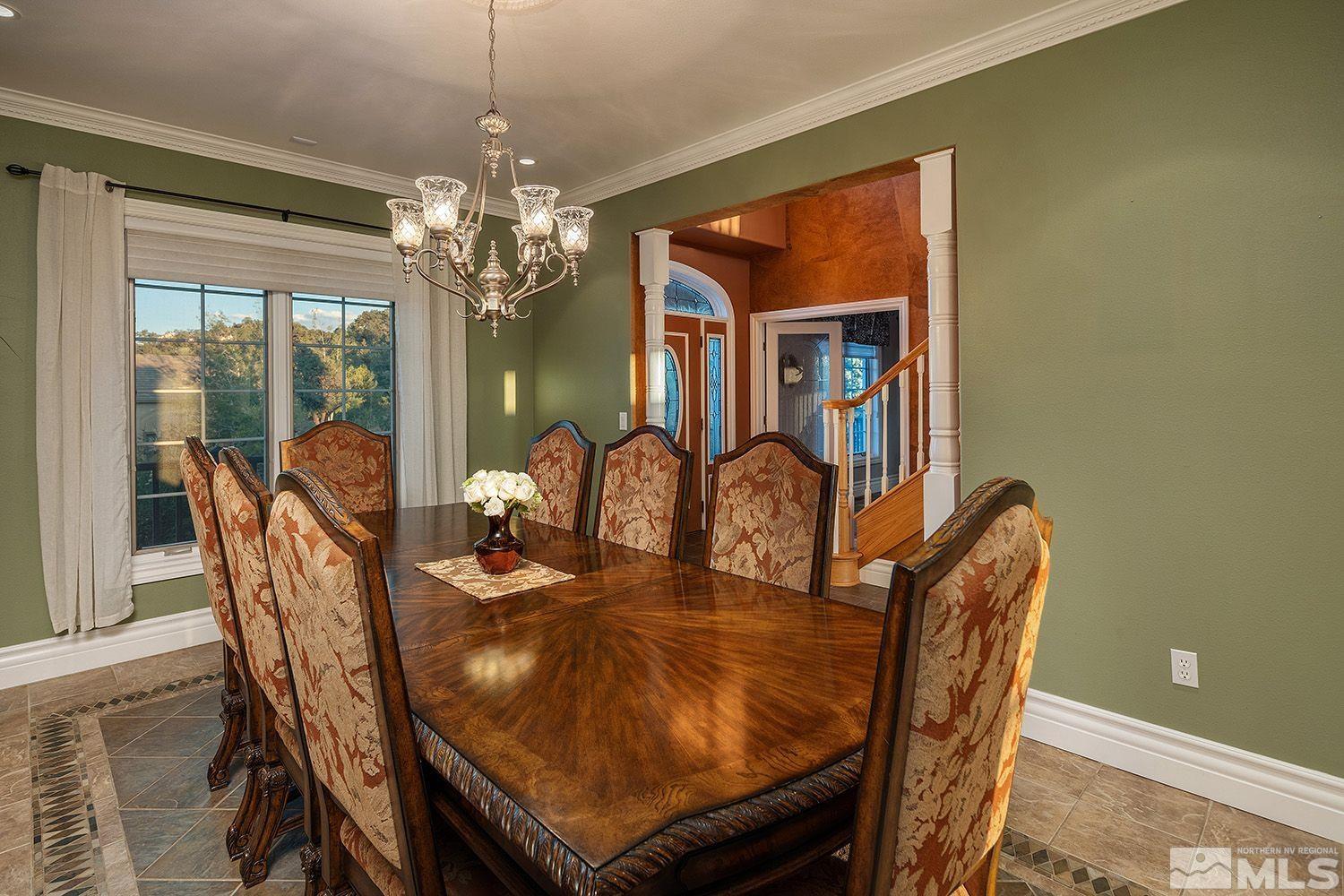 4530 Lousetown Road Reno, NV 89521 - Photo 12 of 39 a view of a dining room with furniture a chandelier and window